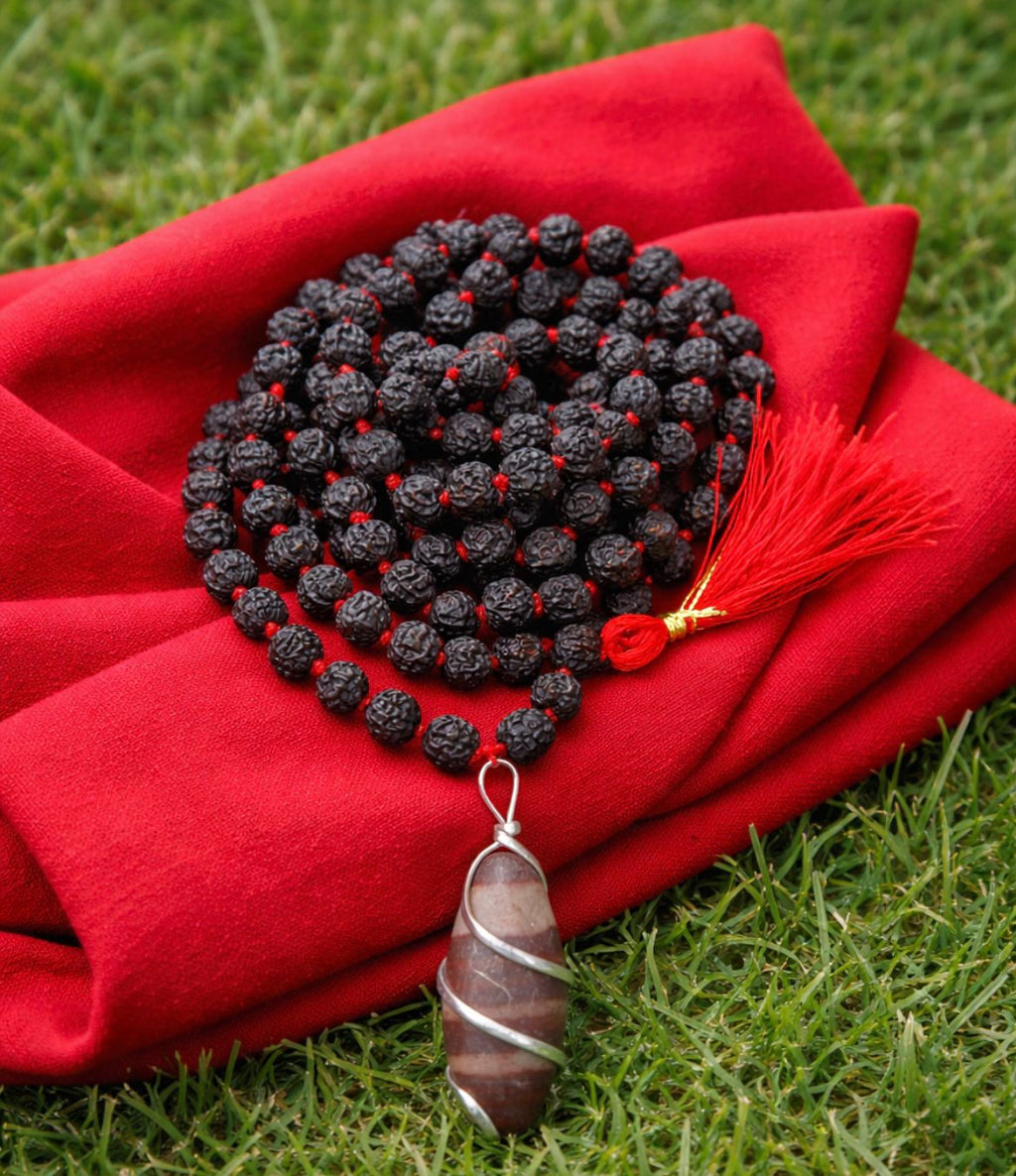 Kashivardan Black Rudraksha Mala with Silver Wire Wrapped Narmadeshwar Stone Pendant | 8mm Natural Beads | Blessed and Purified with Gangajal | Idol for Mens & Womens | Meditation & Pooja