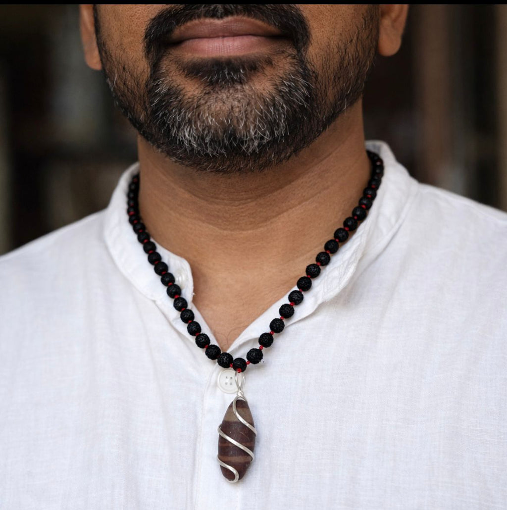 Kashivardan Black Rudraksha Mala with Silver Wire Wrapped Narmadeshwar Stone Pendant | 8mm Natural Beads | Blessed and Purified with Gangajal | Idol for Mens & Womens | Meditation & Pooja