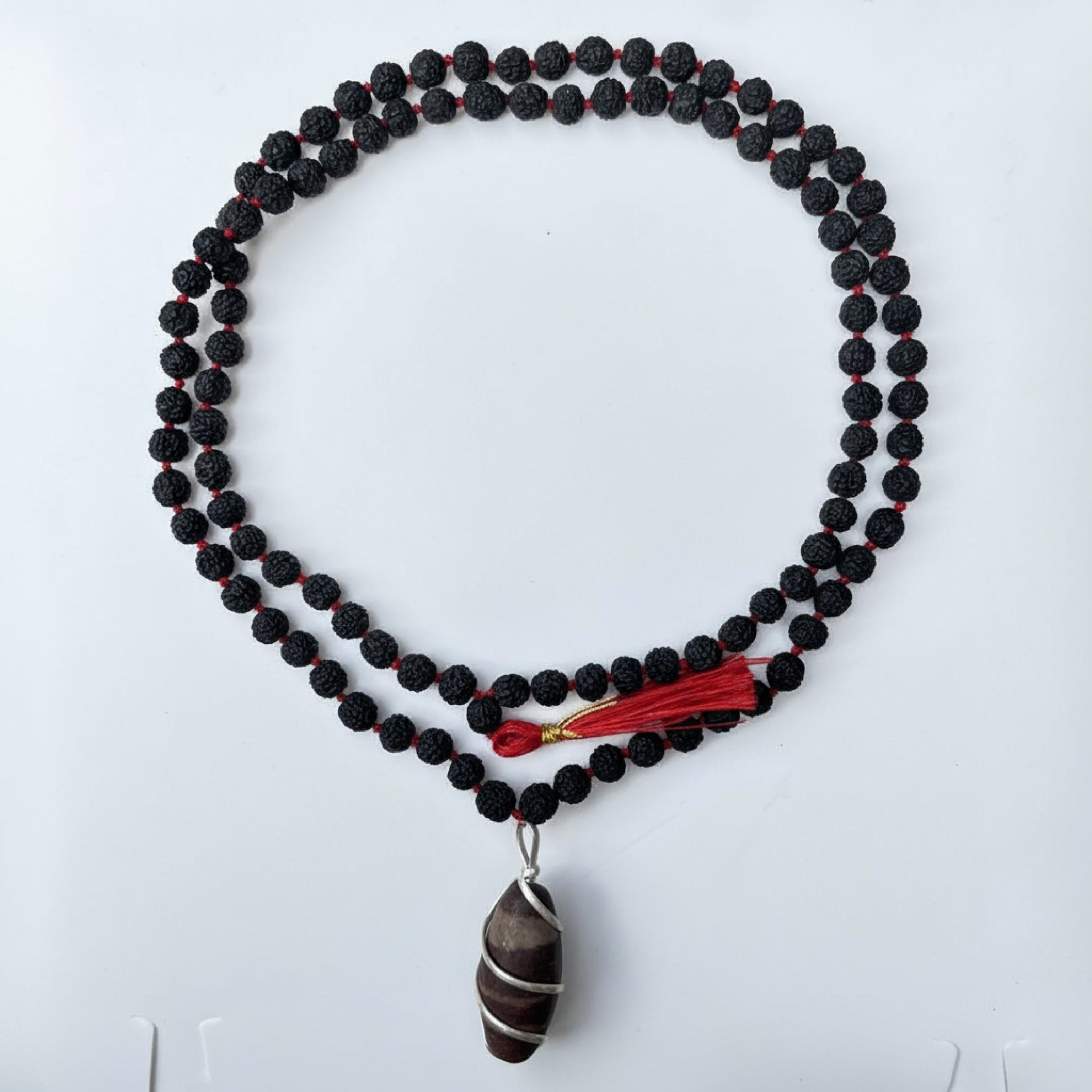 Kashivardan Black Rudraksha Mala with Silver Wire Wrapped Narmadeshwar Stone Pendant | 8mm Natural Beads | Blessed and Purified with Gangajal | Idol for Mens & Womens | Meditation & Pooja