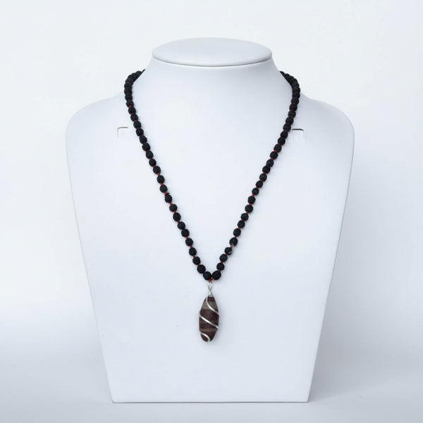 Kashivardan Black Rudraksha Mala with Silver Wire Wrapped Narmadeshwar Stone Pendant | 8mm Natural Beads | Blessed and Purified with Gangajal | Idol for Mens & Womens | Meditation & Pooja